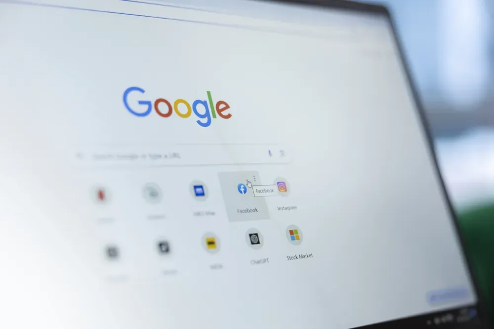 A close-up screenshot of a laptop screen displaying the Google search engine.